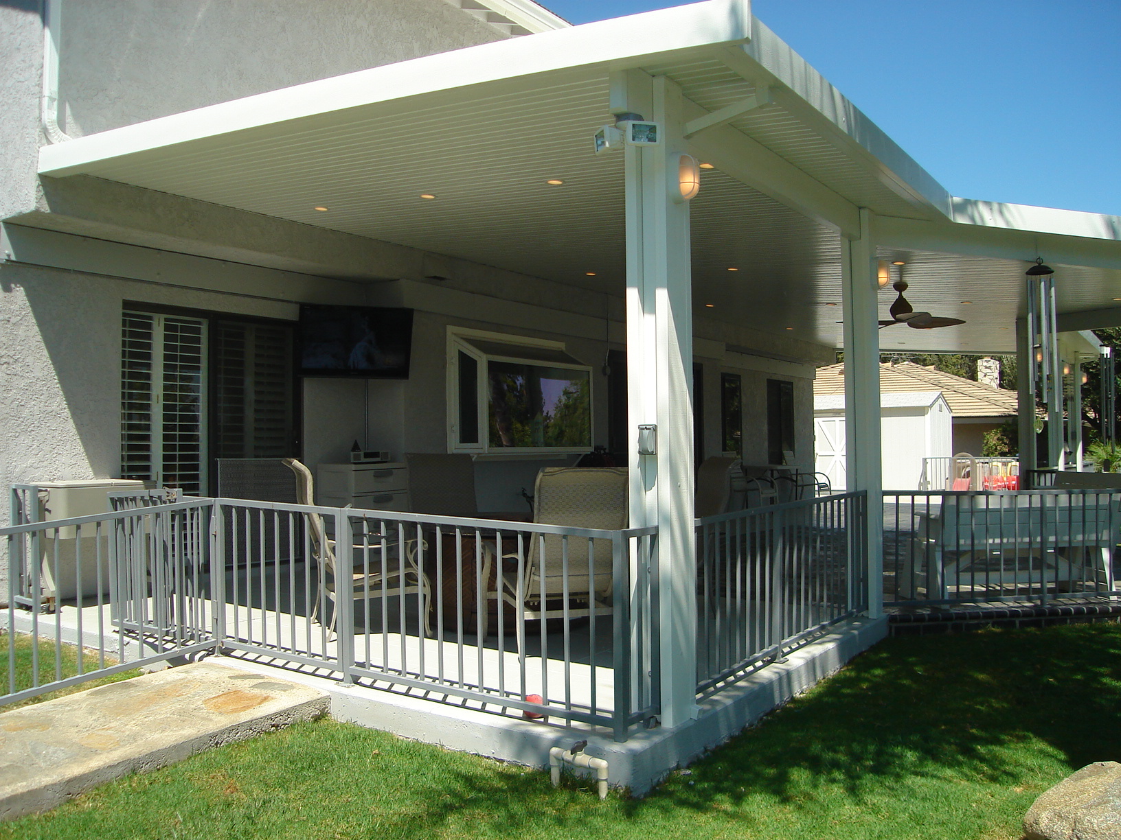 Flat pan patio cover with TheLightStrip roomsncovers