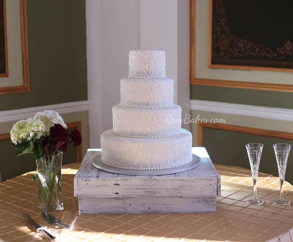 All White Scrollwork Wedding Cake