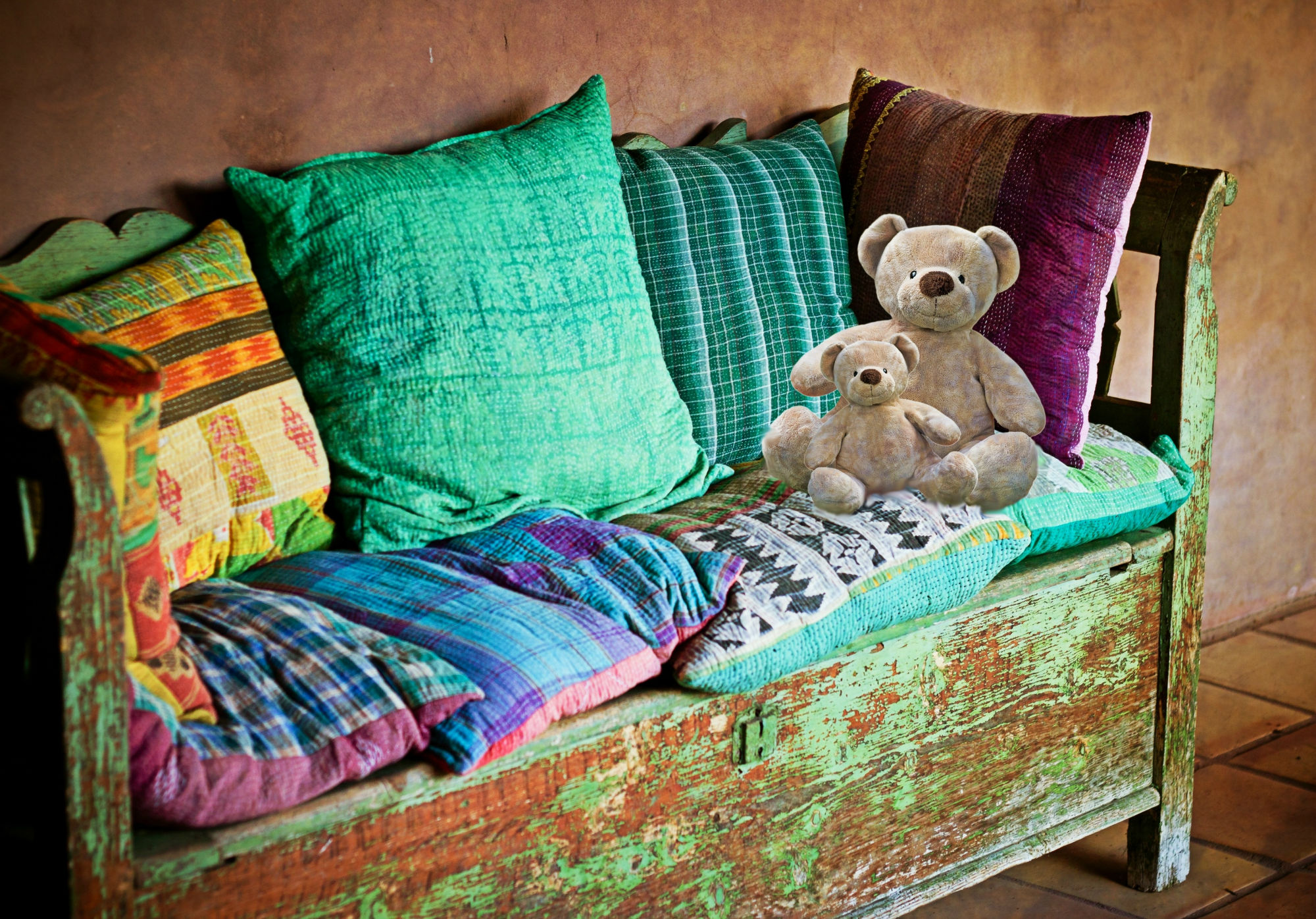 A Colourful Bed Bug Free Sofa with Pillows and Teddy Bears Rox Bugs