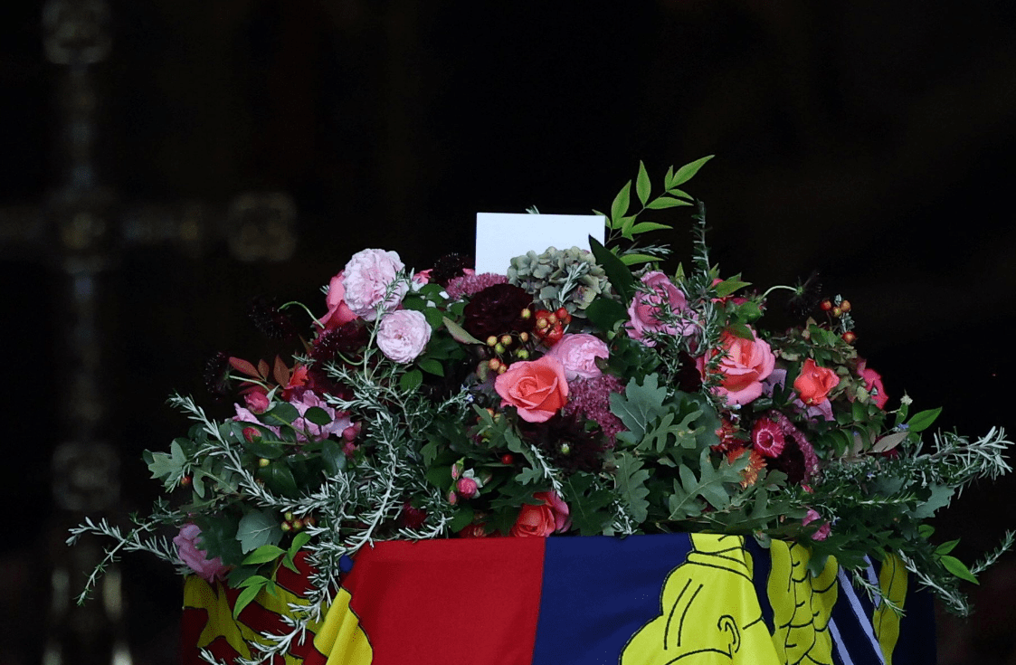 A wreath of flowers from her beloved homes, with a nod to her wedding