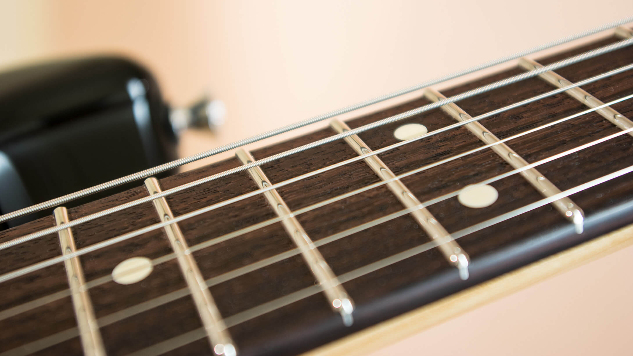 What attributes make a guitar finish play, sound and look right?