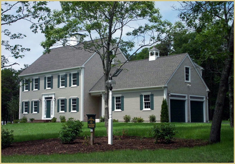 Classic Cape home with back deck and attached garage R.W. Anderson