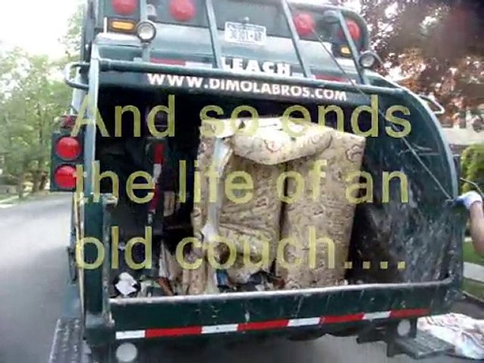 Garbage truck crushing a 4 seat sofa into little bits. video Dailymotion