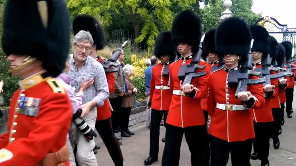 Oblivious Photographer Nearly Run Over By Queen's Guard