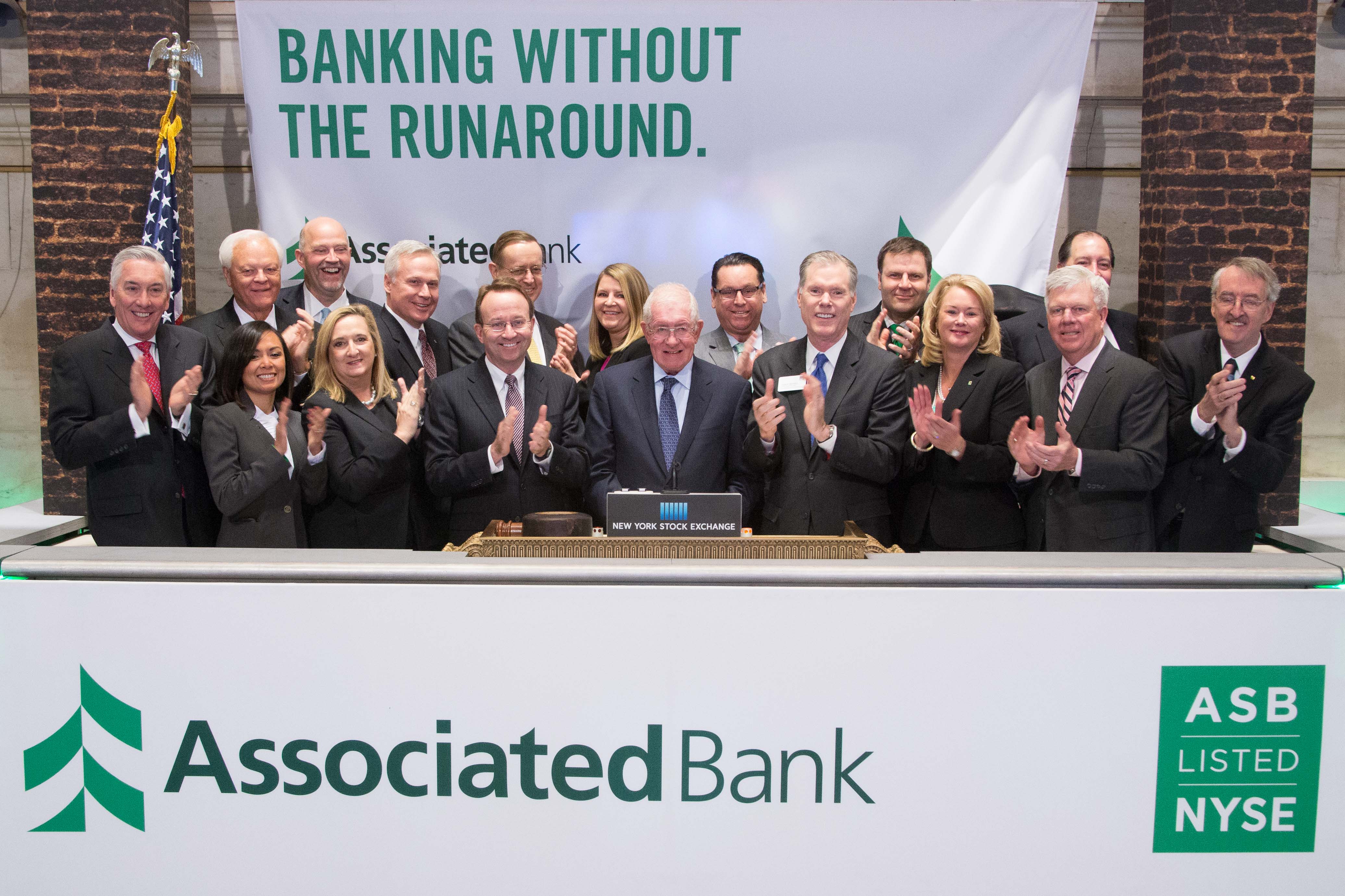 Associated Bank knocks down notion of banking barriers, celebrates