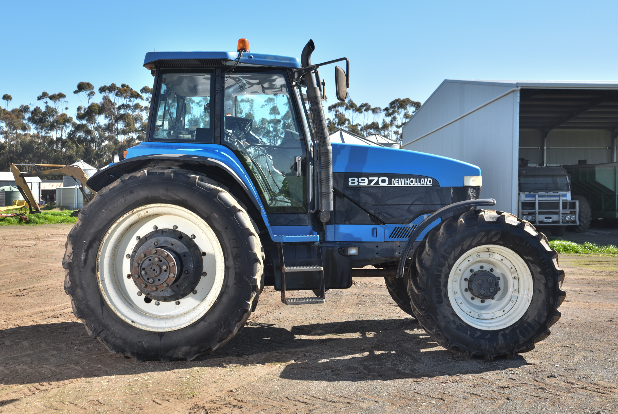 New Holland 8970 FWA Tractor 2 Buyers Premium on All Lots