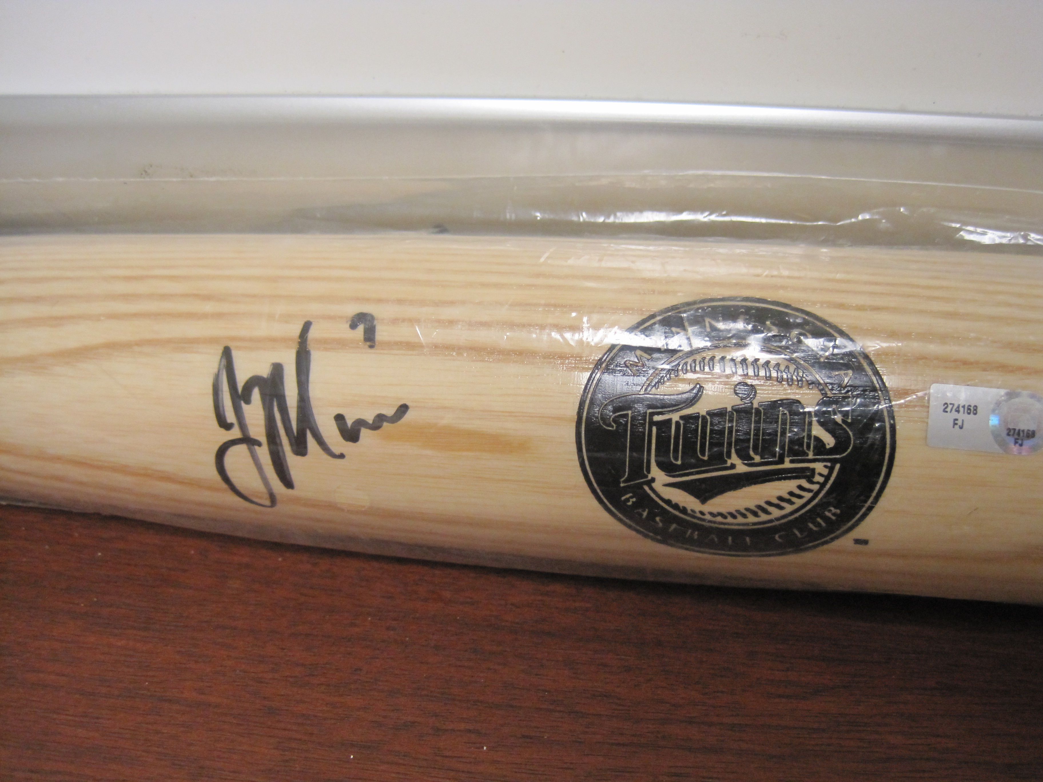 Charitybuzz Autographed Baseball Bat from Joe Mauer of the Minnesota