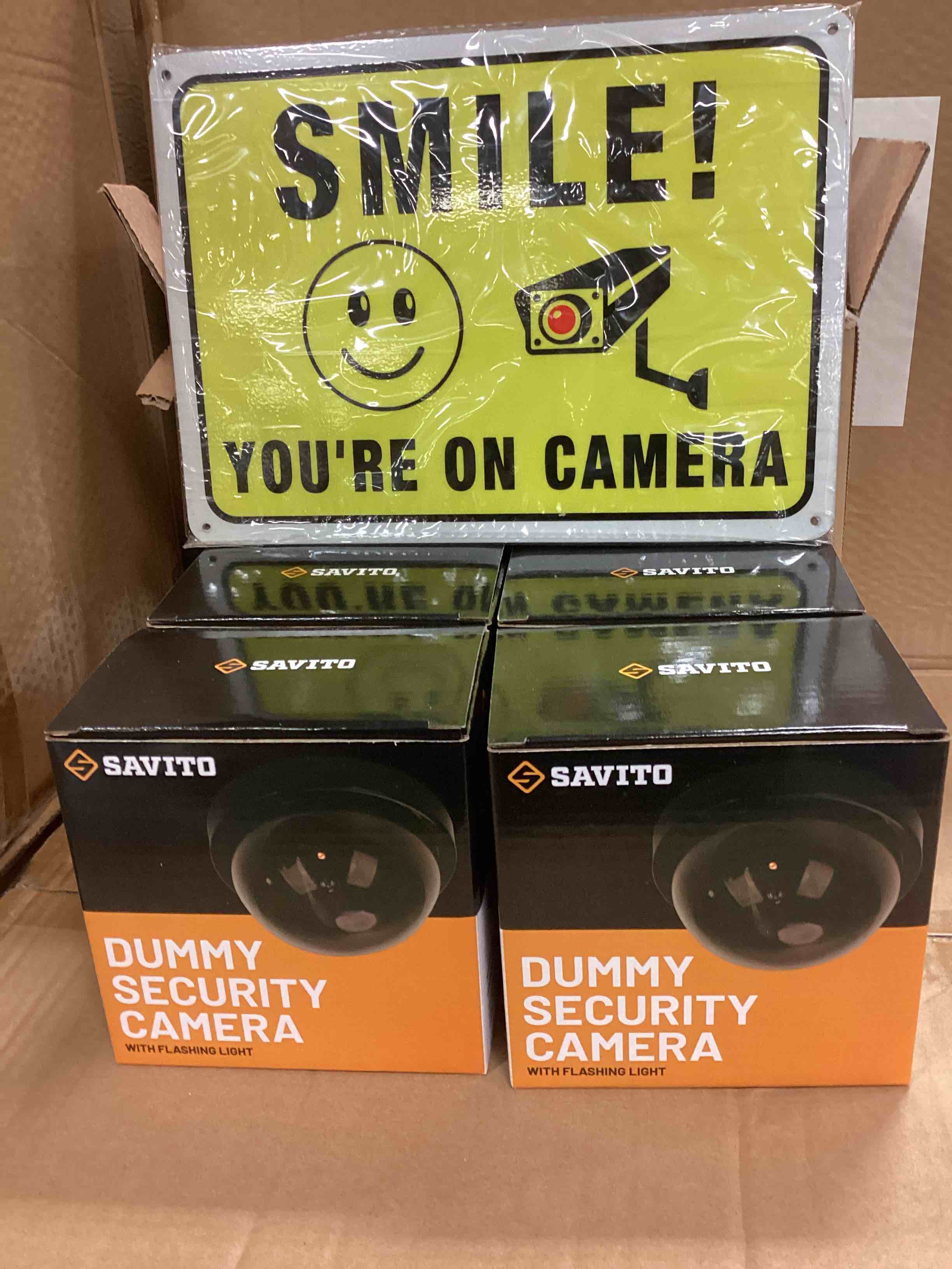 four pack dummy, security cameras with flashing light and metal signs