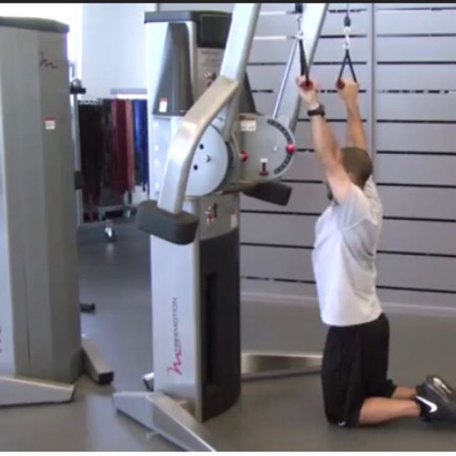Kneeling Cable lat Pull Down Exercise Howto Workout Trainer by Skimble