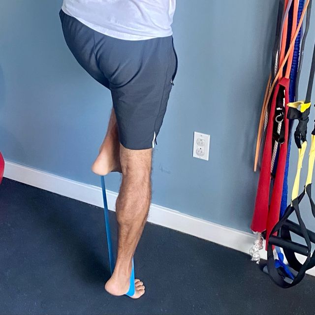 raised heel band single leg raiseknee straight calf raise by Tony M. Exercise Howto Skimble