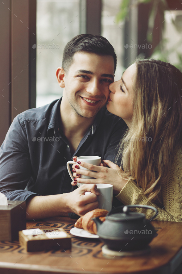 Couple in love drinking coffee in coffee shop Stock Photo by arthurhidden