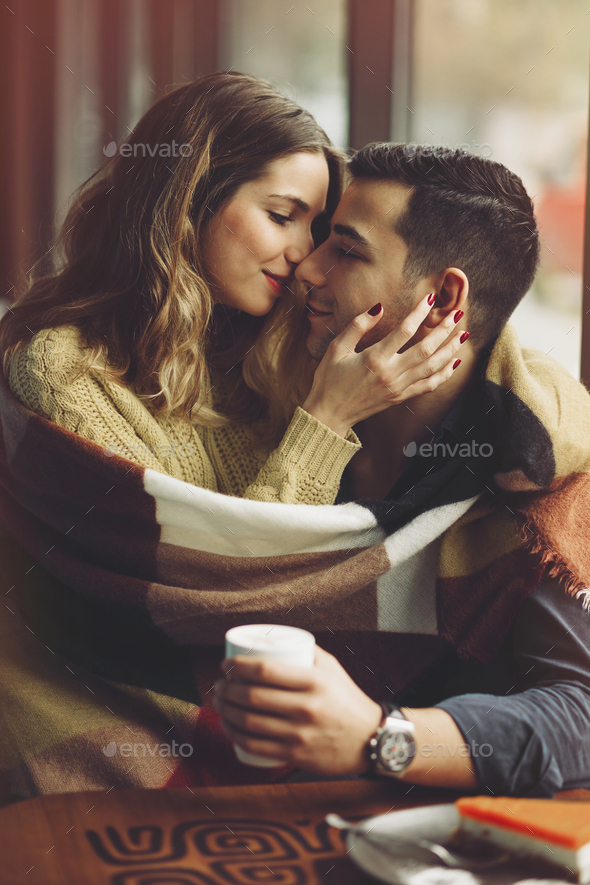 Couple in love drinking coffee in coffee shop Stock Photo by arthurhidden