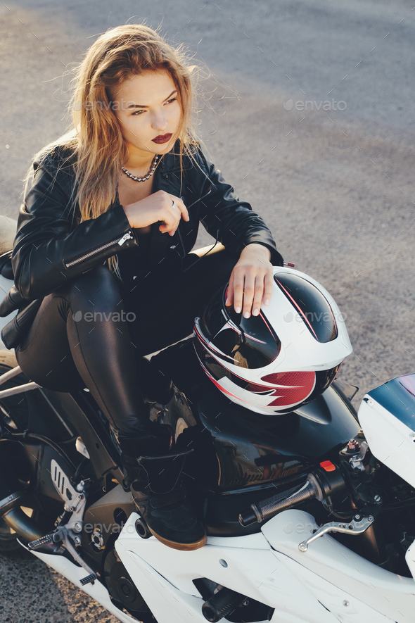 Biker girl in a leather clothes on a motorcycle Stock Photo by arthurhidden