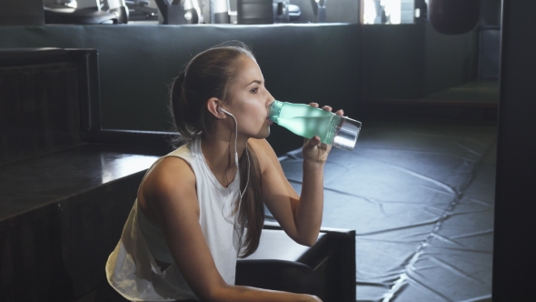 Sexy Young Fitness Woman Drinking Water Resting After Gym Workout By Kotlyarn