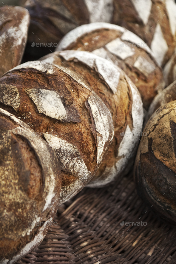 Rustic bread on wicker baskets in a bakery Stock Photo by Redzen2