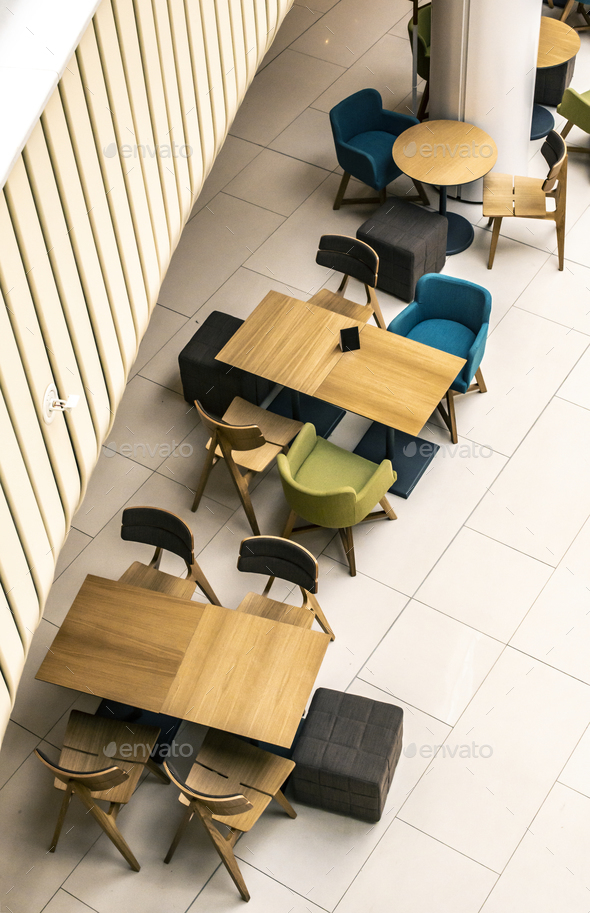 Tables and chairs in cafe. ontemporary design of bar furnishings Stock