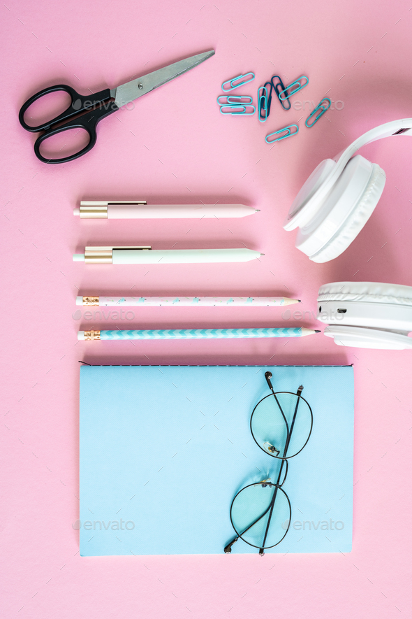 Pens, pencils, clips, scissors, headphones, eyeglasses and blue