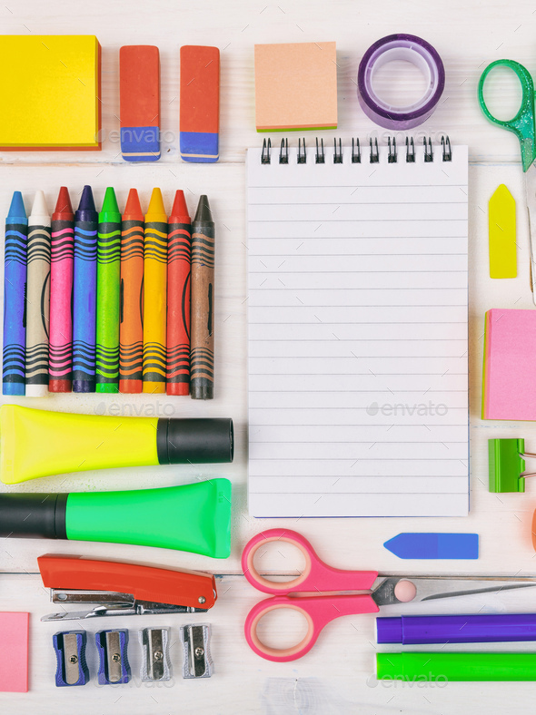 School supplies on wooden desk. Kid creativity flat lay Stock Photo by