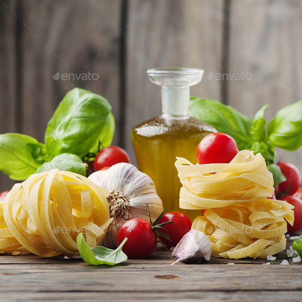 Fresh tomato, basil, olive oil pasta Stock Photo by OxanaDenezhkina