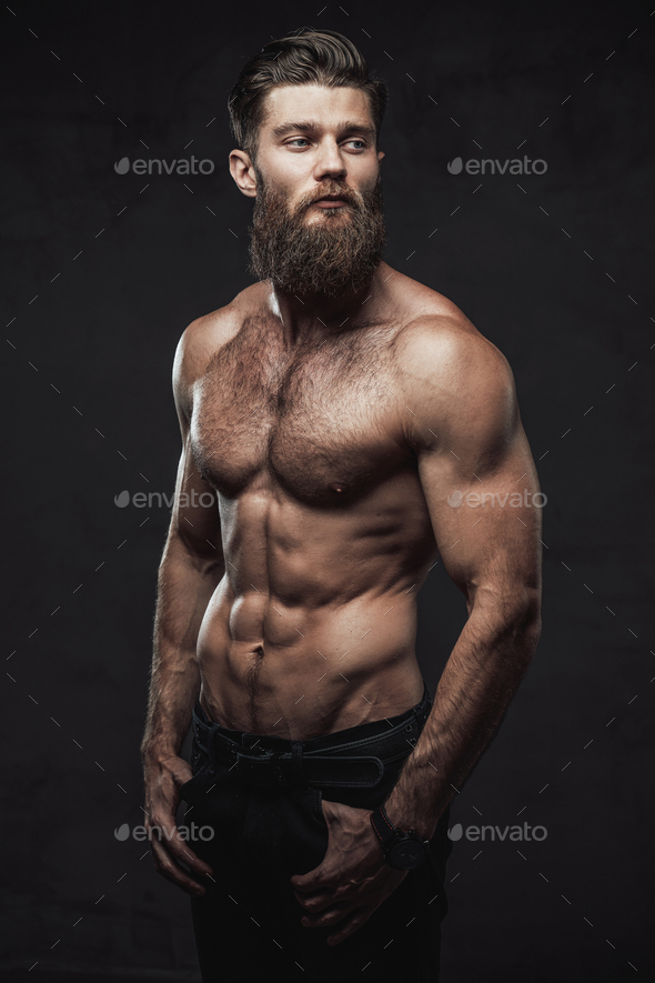 Naked and muscular guy posing in dark background Stock Photo by fxquadro