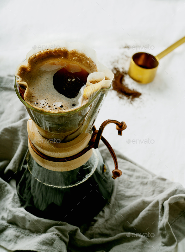 Preparing filtered coffee with dripper Stock Photo by SebastianaRaw