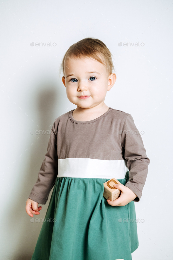 Baby fashion. Unisex color clothes for babies. Cute baby girls in