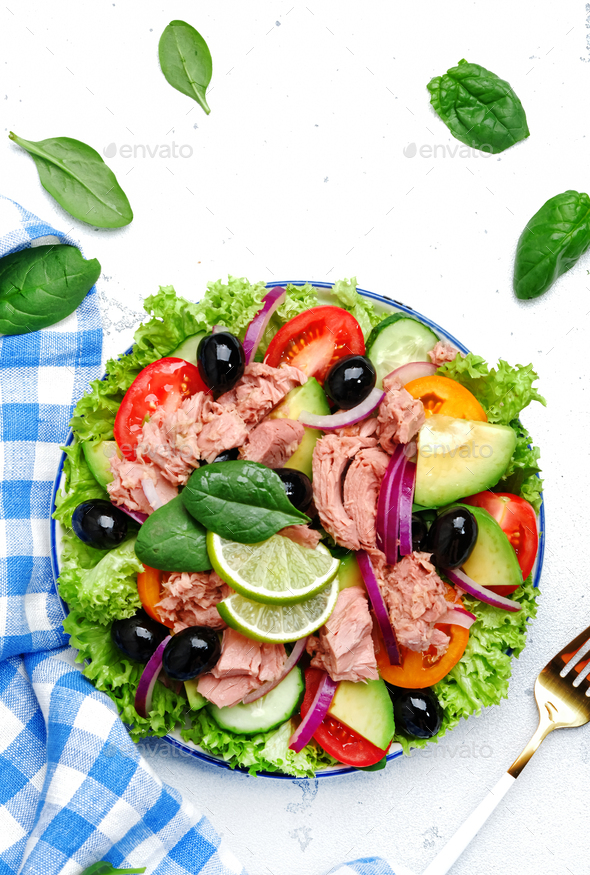 Tuna fish salad with avocado, tomato, cucumber, black olives, spinach