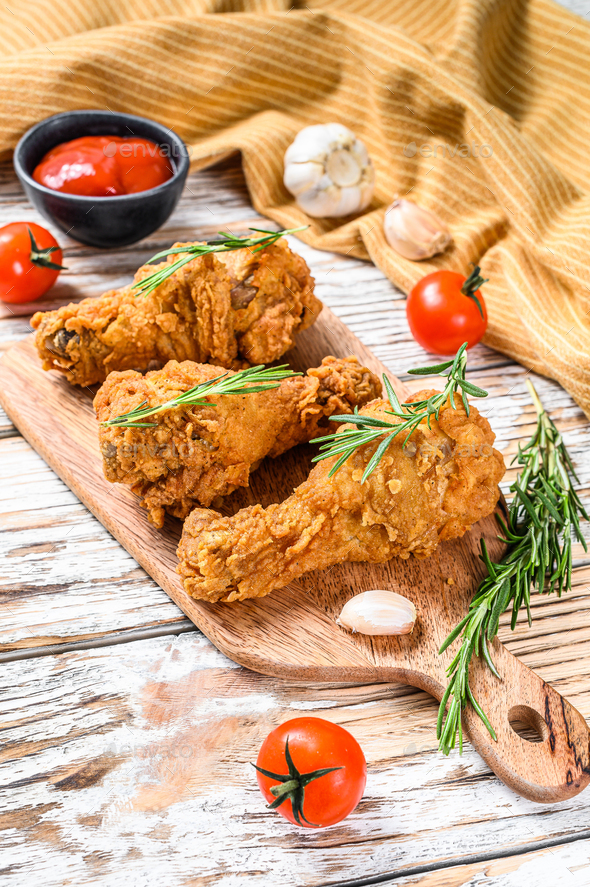Spicy Deep Fried Breaded Chicken drumsticks. White background. Top view