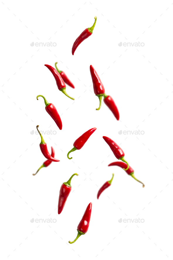 Fresh red chilli peppers floating in the air. food levitation. Falling