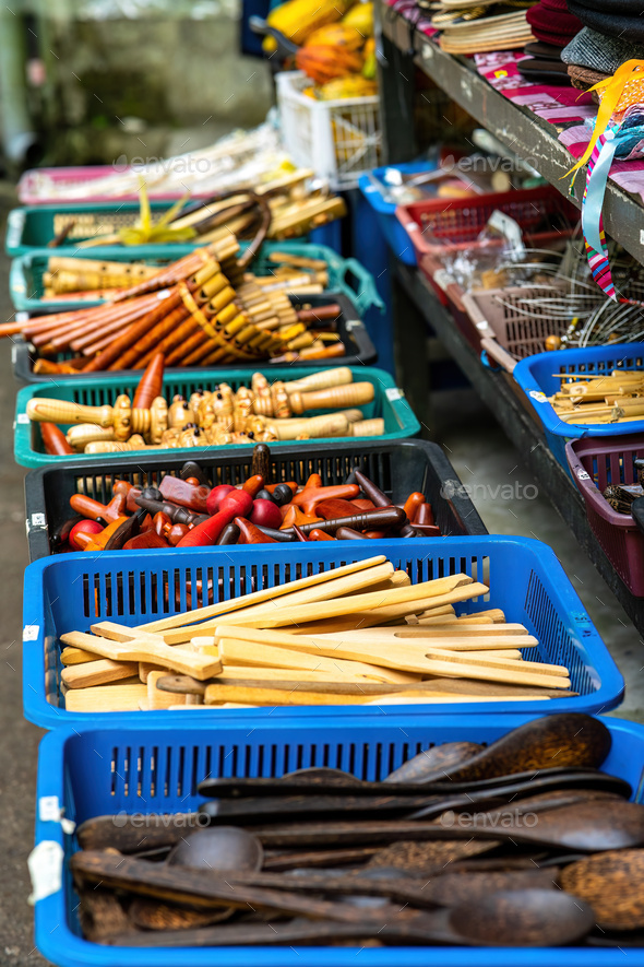 Wooden kitchen utensils in the basket for sale at the market in
