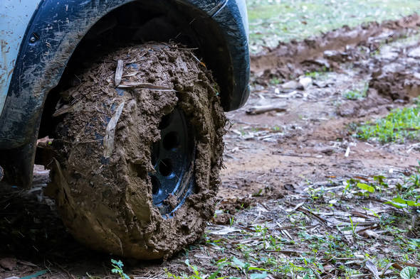 Tire has been mired in the mud. Wheel closeup with a muddy. Wheel of