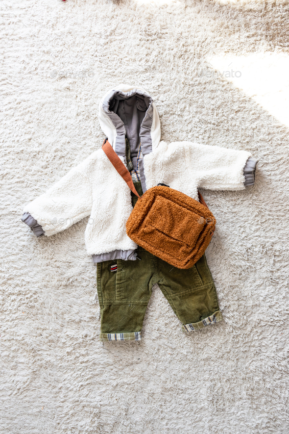 Set of baby clothes and bag on white background. Fashion baby clothes