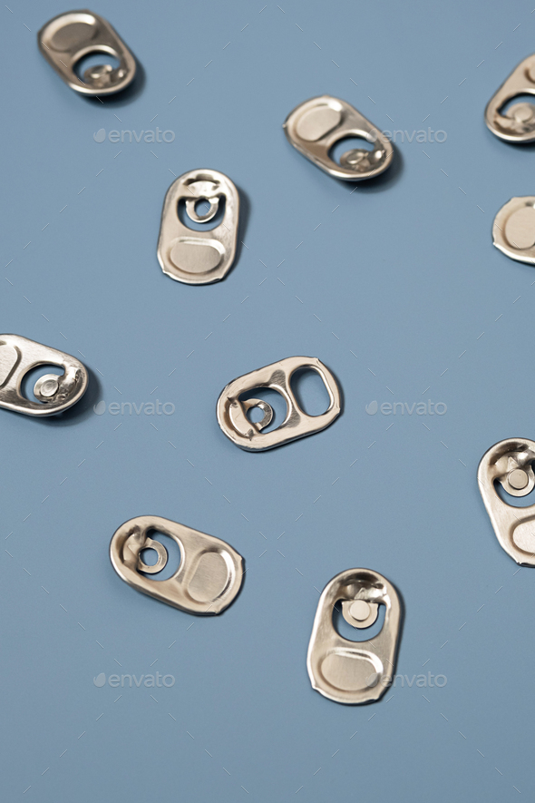Ring pull tabs for open of drinking can. Stock Photo by zhennyzhenny
