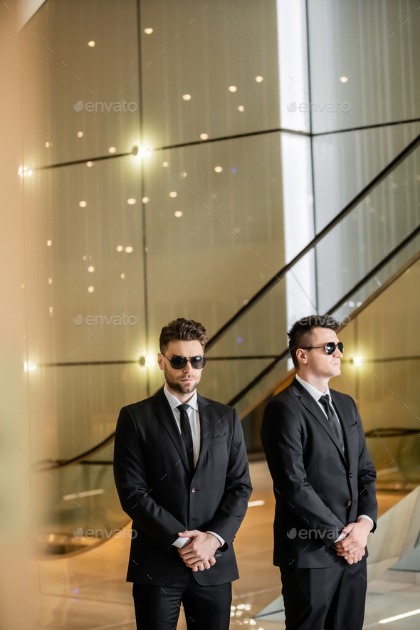security management of hotel, two handsome men in formal wear and