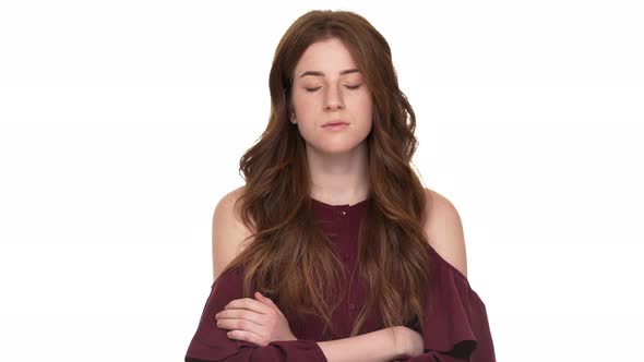 Portrait of Strict Female in Casual Standing with Arms Crossed and
