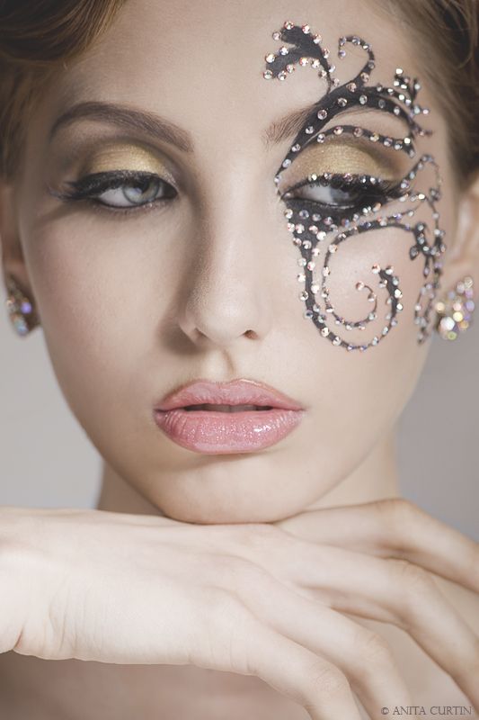 Makeup With Blackcolored Swirls And Rhinestone At The Corner. 2051867