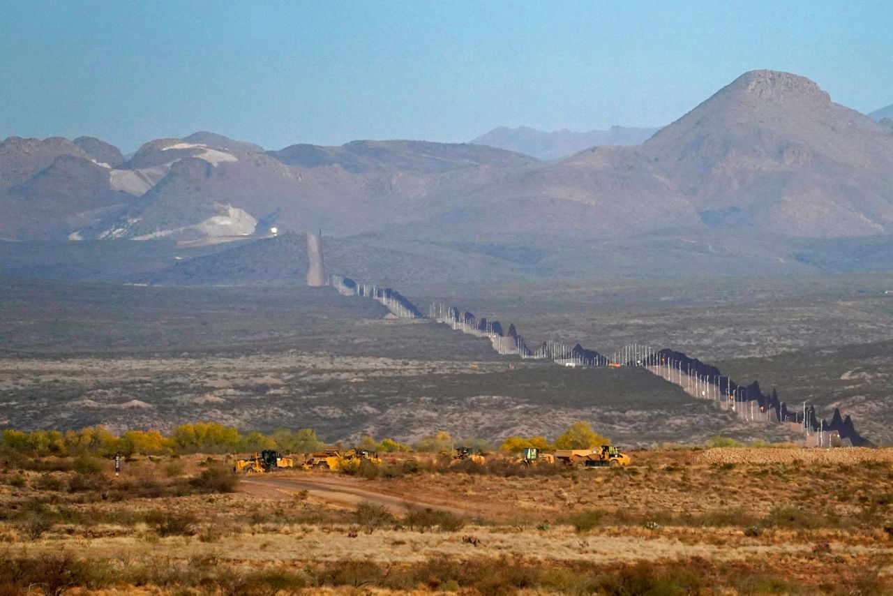 Damage from border wall blownup mountains, toppled cactus