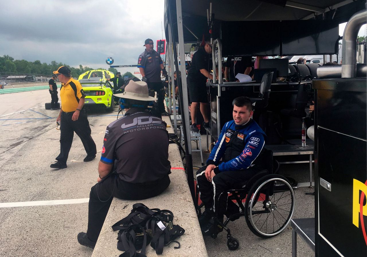 Paraplegic race car driver scores 1st pro win, seeks more