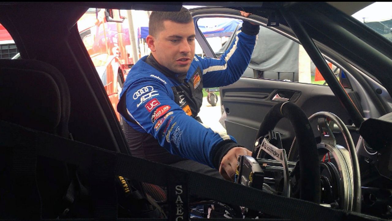 Paraplegic race car driver scores 1st pro win, seeks more