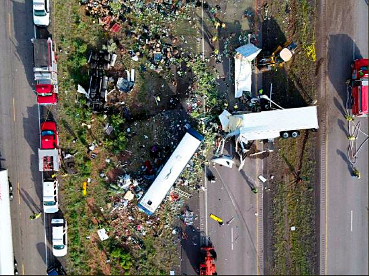 US agency examines front tires of semitrailer that hit bus