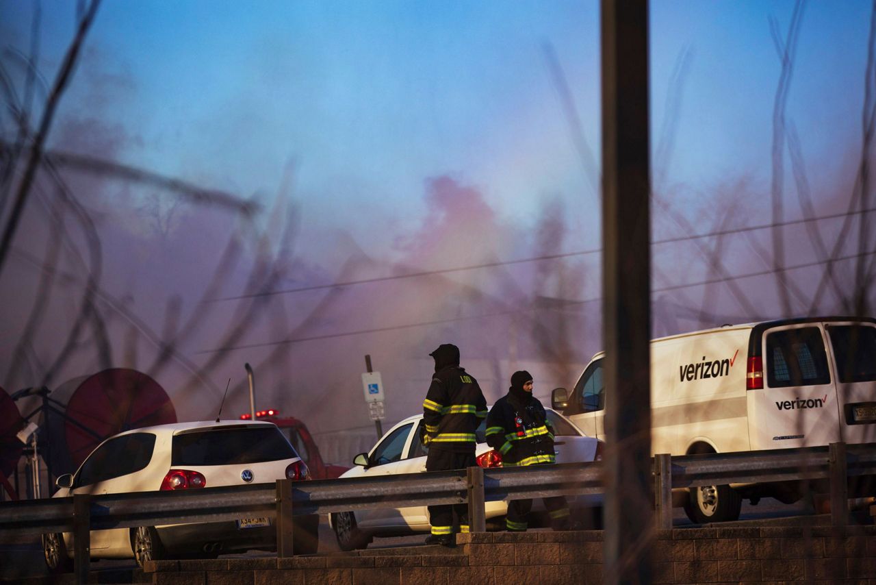 Crews battle flames, cold, wind in huge recycling plant fire