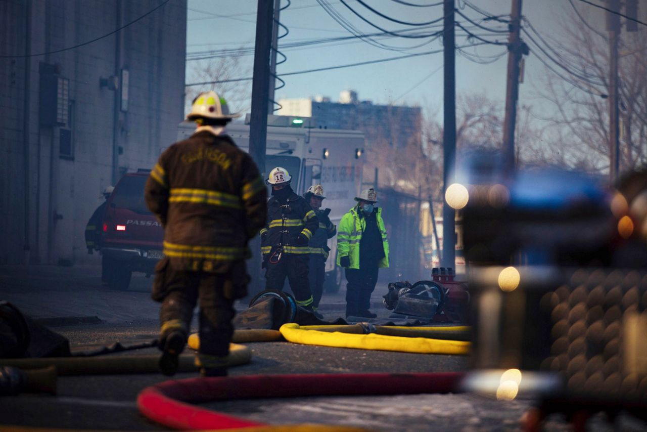 Crews battle flames, cold, wind in huge recycling plant fire