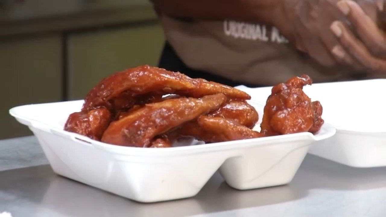 Frying up legendary Mumbo wings at the Broadway Market