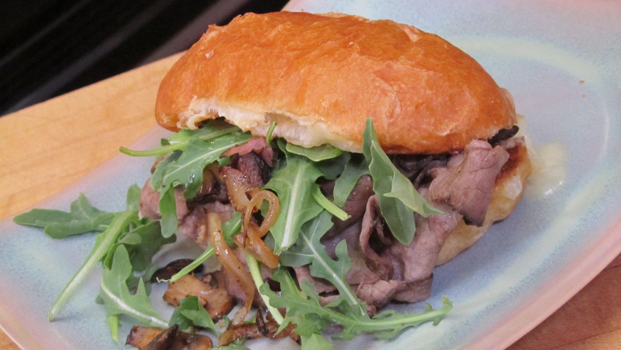 Hot Roast Beef Sandwich with Mushrooms, Onions, Swiss Cheese and Arugula