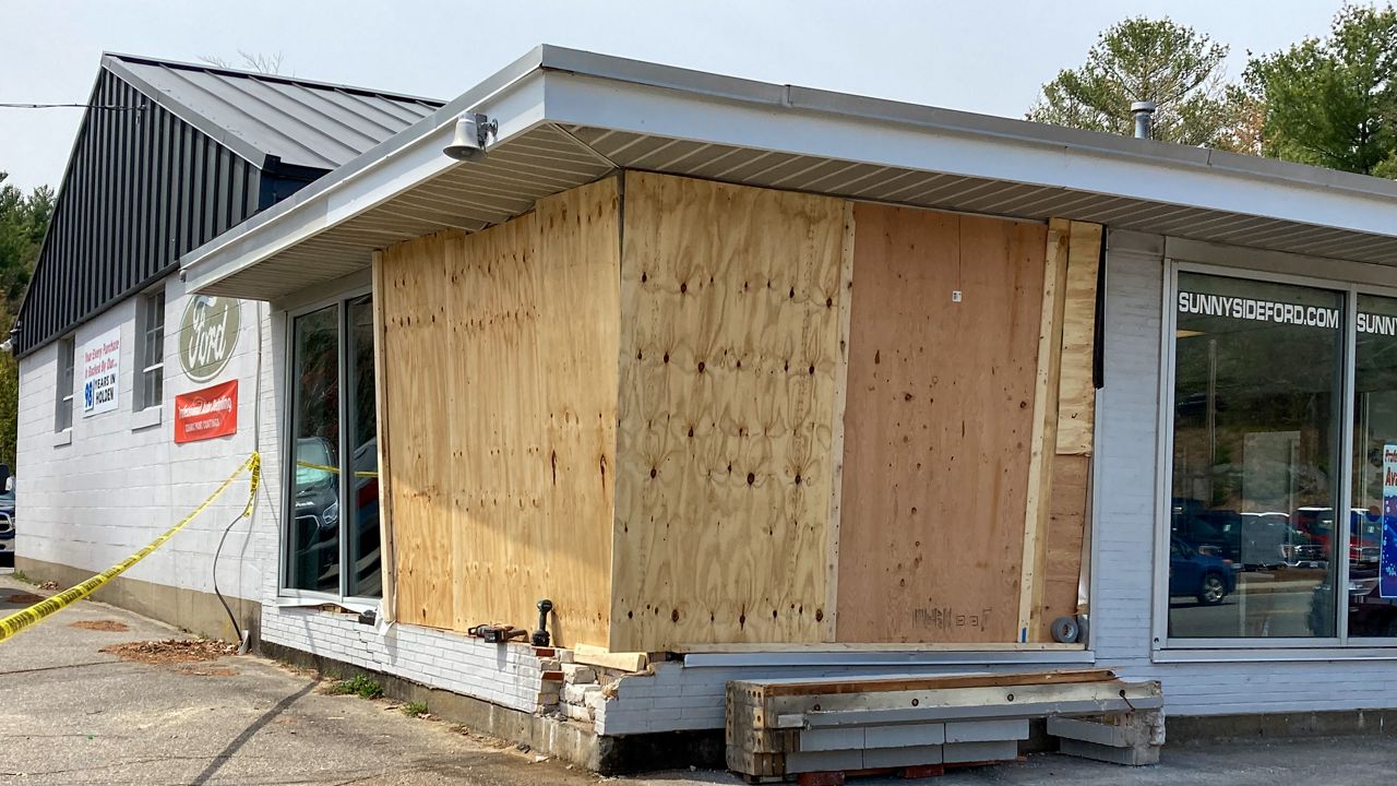 Crash into Holden car dealership