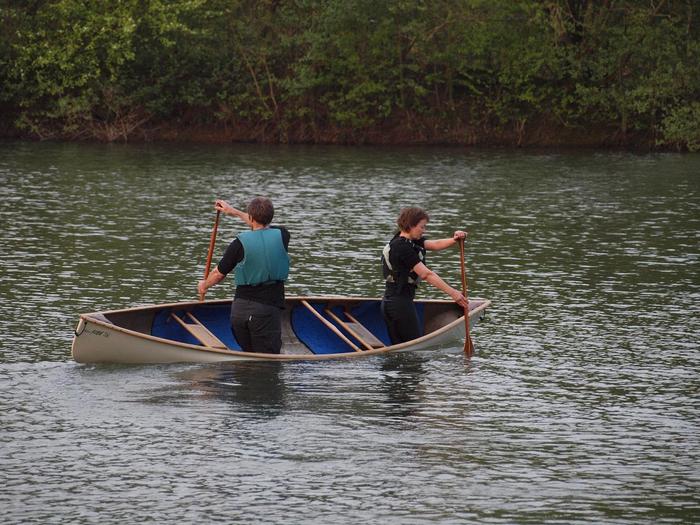 Three people paddling one canoe Song of the Paddle Forum