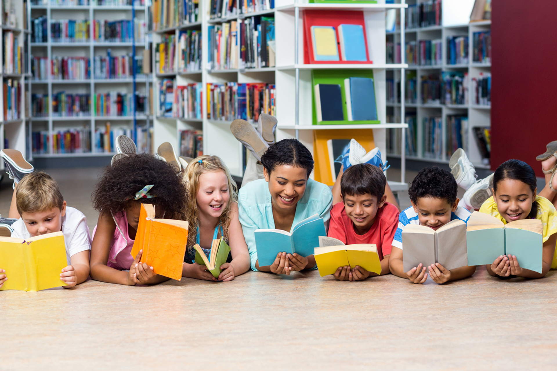 Teacher with students reading books while lying down Sabra Books