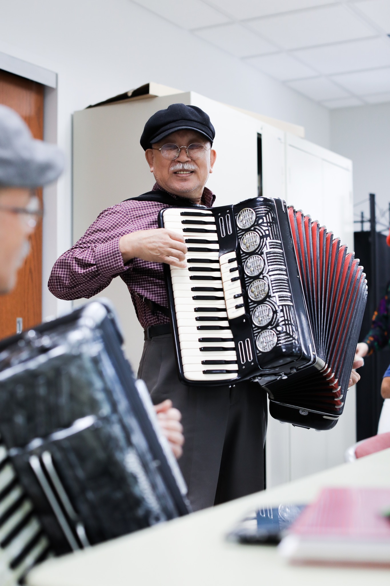 Seniors learn accordion in Flushing Salvation Army Connects