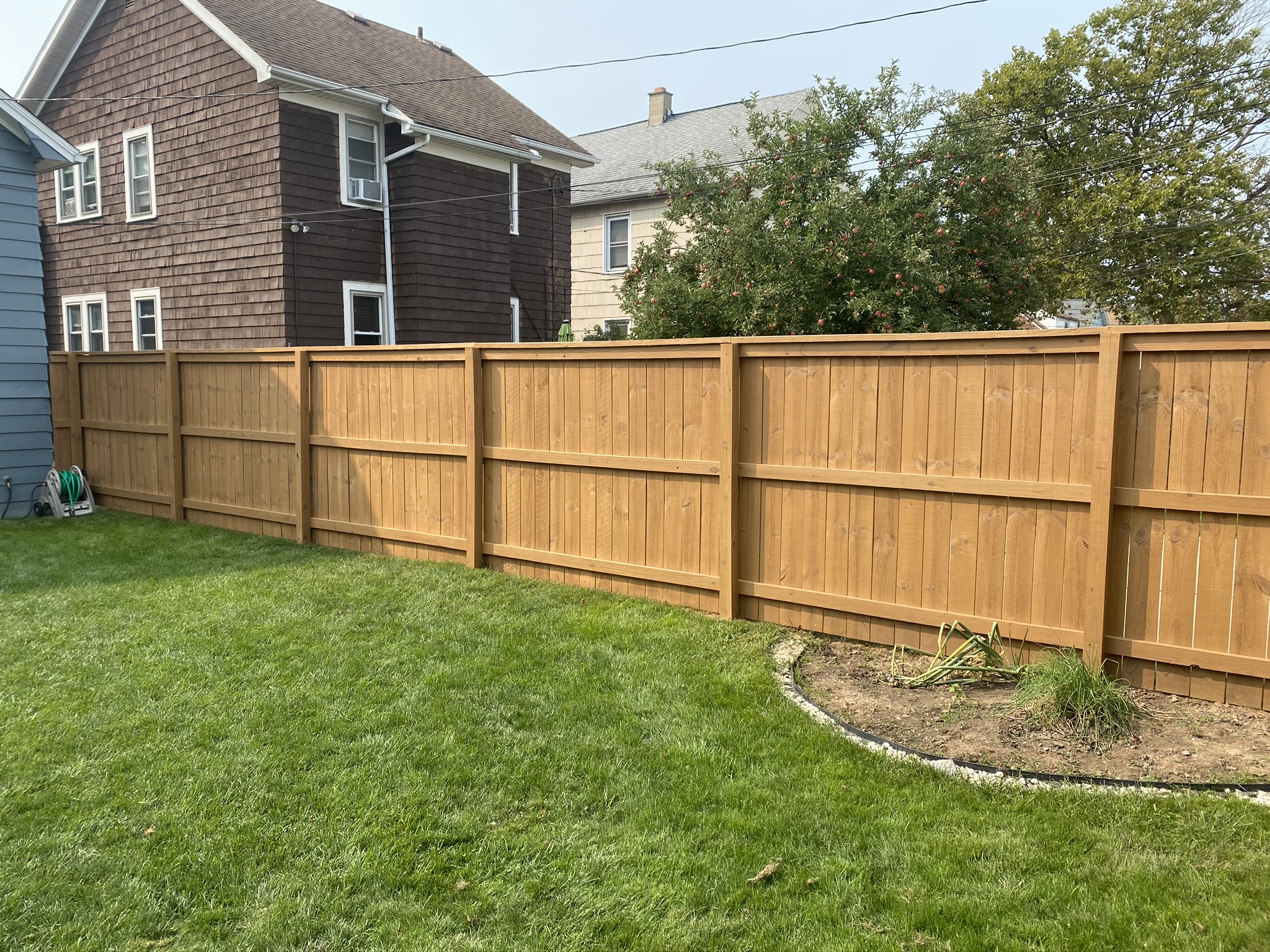 Fence Staining Sadler Fence and Sons LLC