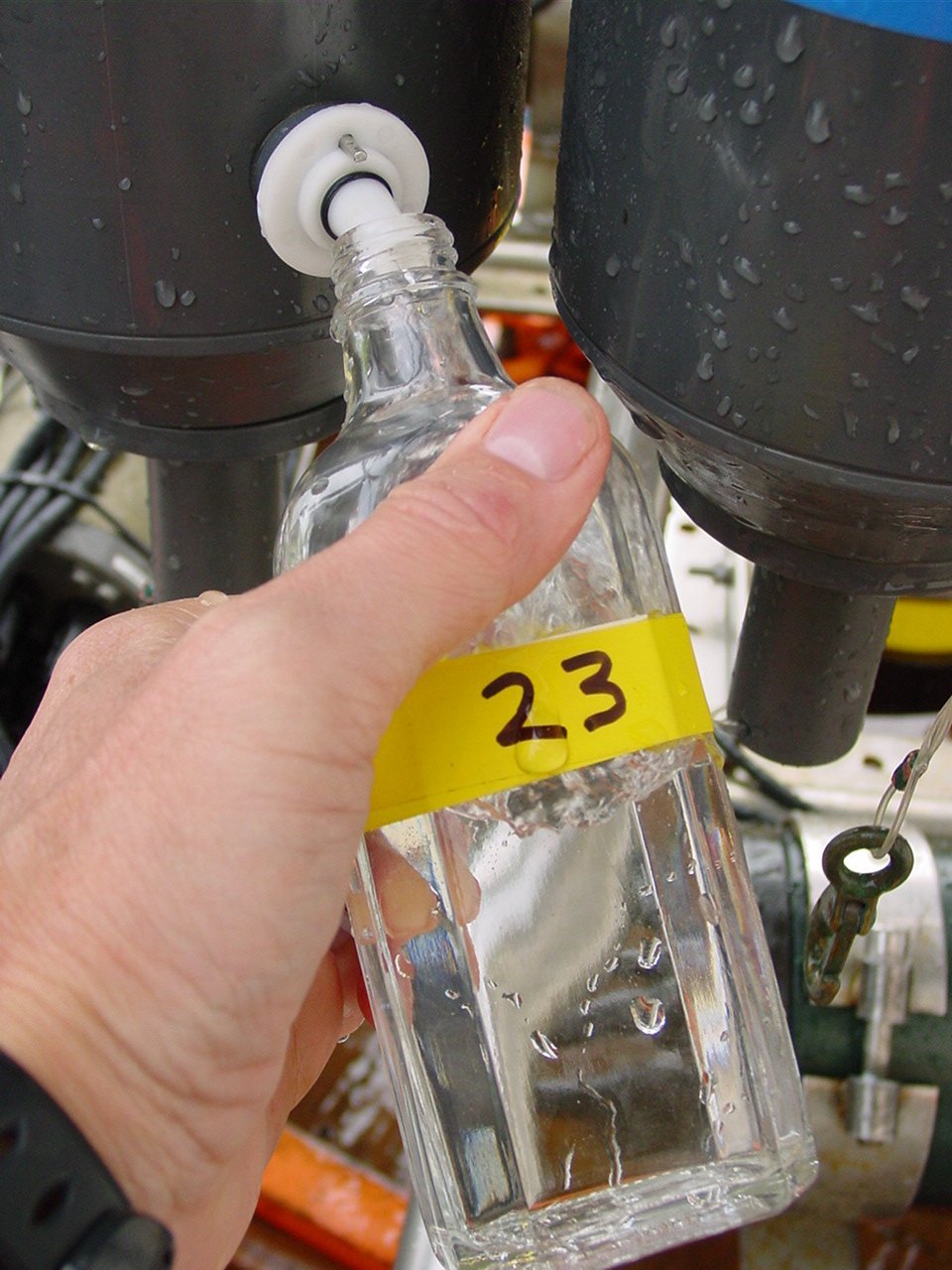 Rinse bottle and cap three times with sample water.